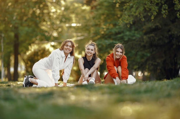 Girls spend time in a summer park