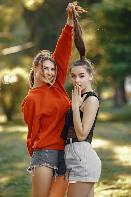 Girls spend time in a summer park