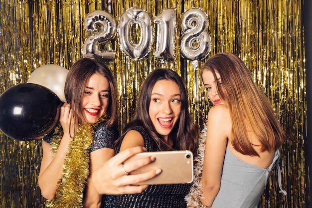 Girls taking selfie on new year night