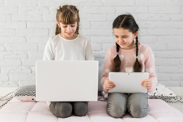 Free photo girls using laptop together