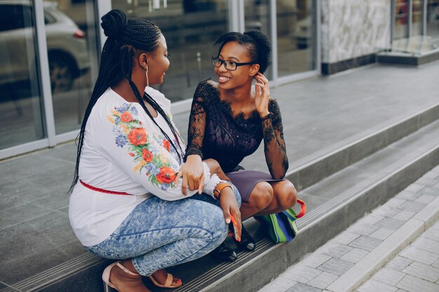 Girls walk along the streets of the city