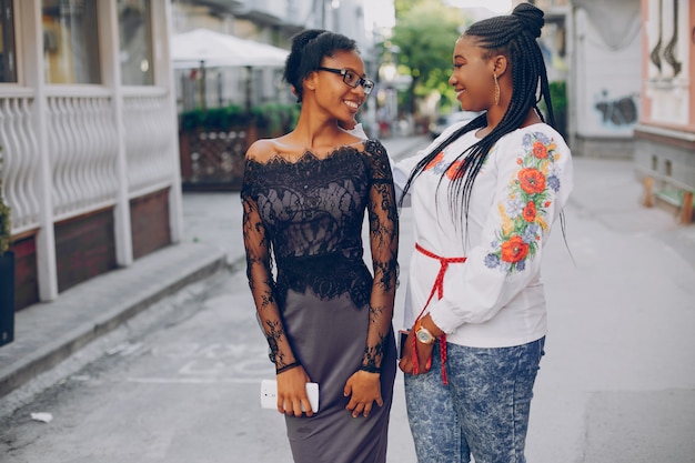 Girls walk along the streets of the city