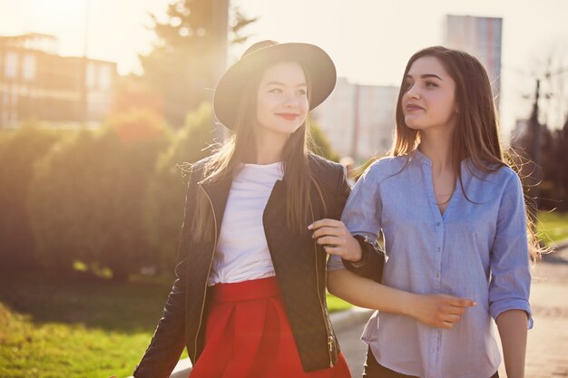 girls walking with shopping on city streets