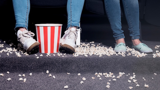 Girls with popcorn in cinema