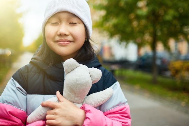 Giving hug to teddy