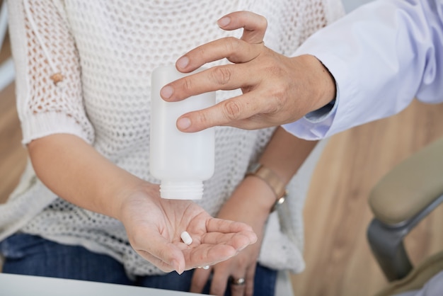 Giving Pill to Patient