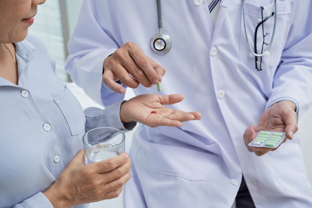 Giving Pills to Patient