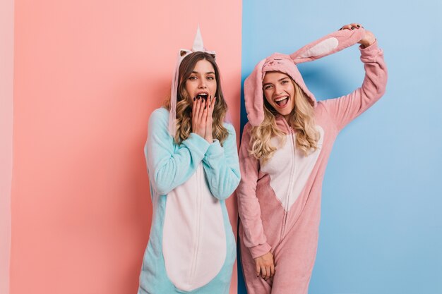 Glad blonde woman posing in bunny kigurumi