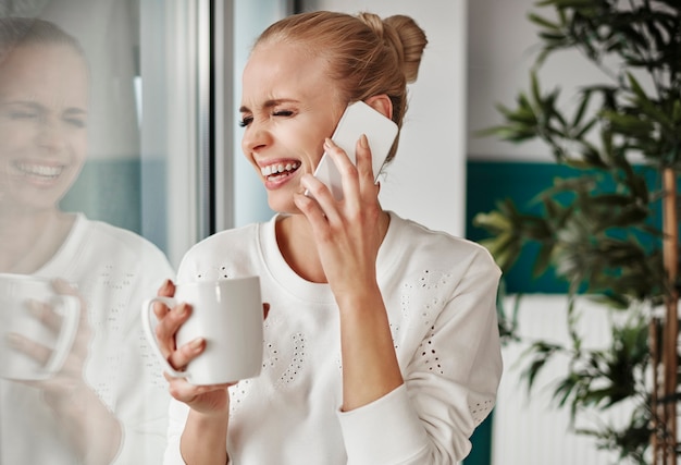 Glad businesswoman during short break