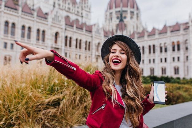 Glad european woman using gps during vacation in Europe