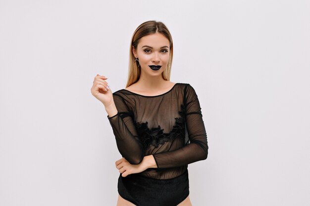 Glad woman in black bodysuit