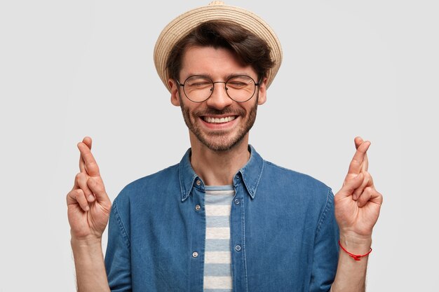 Glad young Caucasian male with pleasant smile