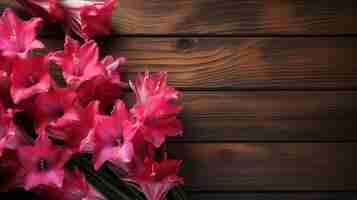 Free photo gladiola flowers on a wooden surface