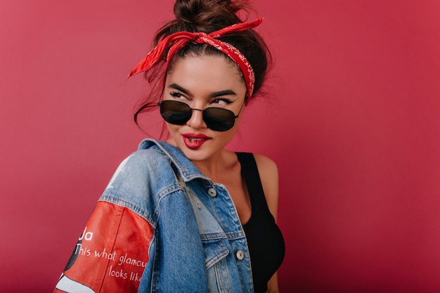 Glamorous caucasian lady in casual clothes playfully looking away