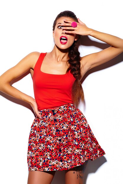 glamour stylish beautiful  young woman model with red lips  in summer bright colorful  hipster cloth