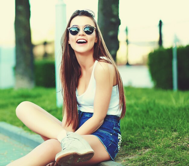 glamour stylish woman model in summer bright cloth in the street