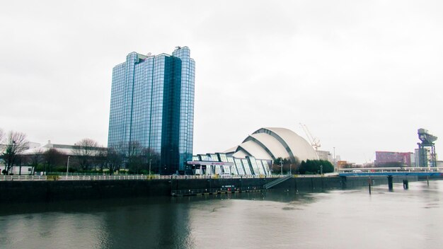 Glasgow cityscape United Kingdom Modern office Clyde river and cloudy weather