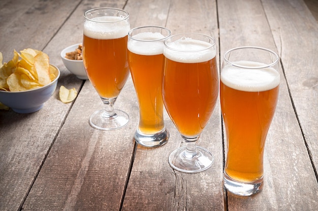 Glass beer on wood background