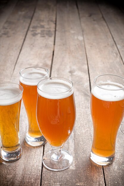 Glass beer on wood background