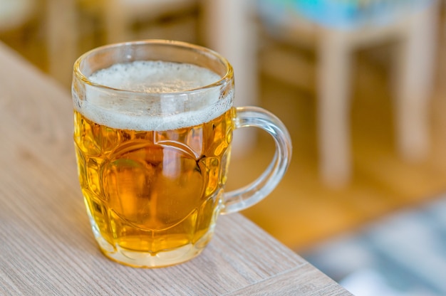 Glass of beer on a wooden table