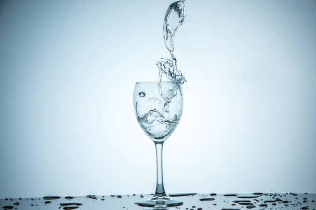 Glass being filled with water