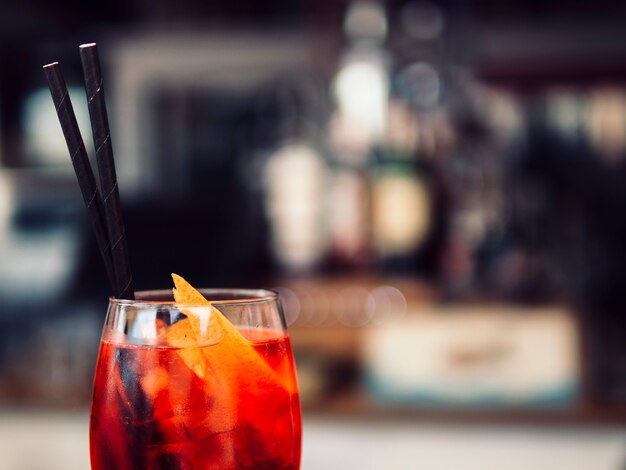 Glass of beverage with orange slices