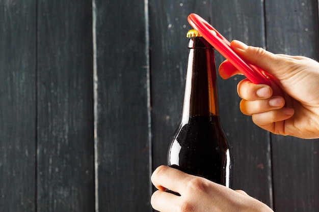 Glass bottle of beer and opener