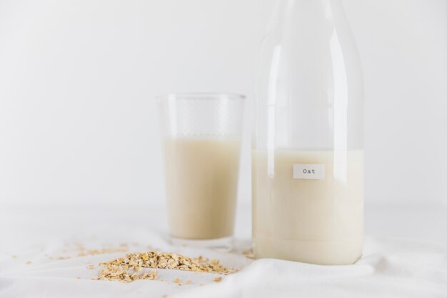 Glass and bottle of milk and cereals