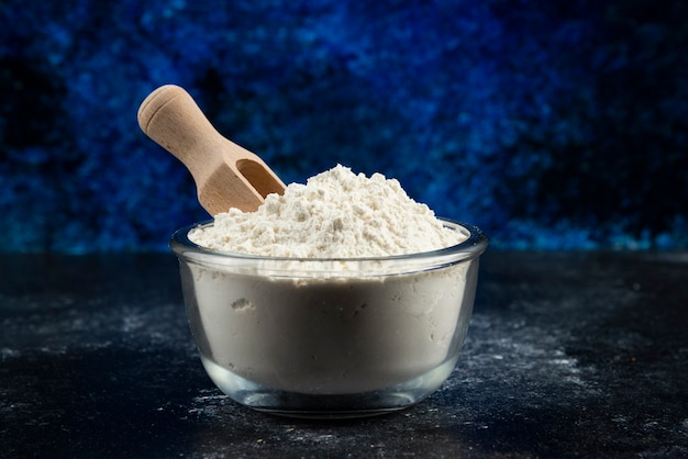 Free photo glass bowl of flour on blue.