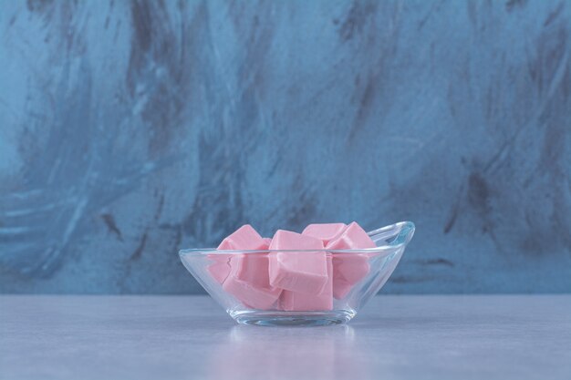 A glass bowl full of pink sweet confectionery Pastila 