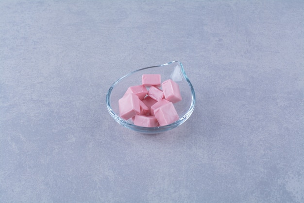 A glass bowl full of pink sweet confectionery Pastila 