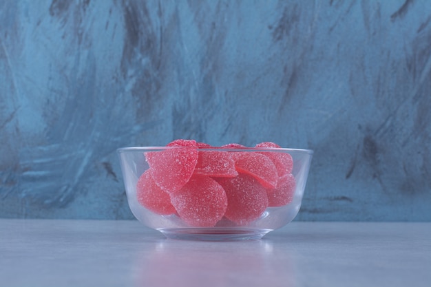 glass-bowl-full-red-sugary-jelly-candies-gray-table_114579-84484.jpg