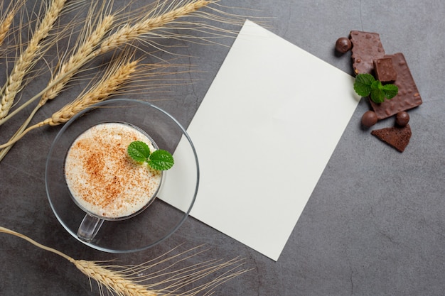 Free photo glass of chocolate milk on the dark surface.