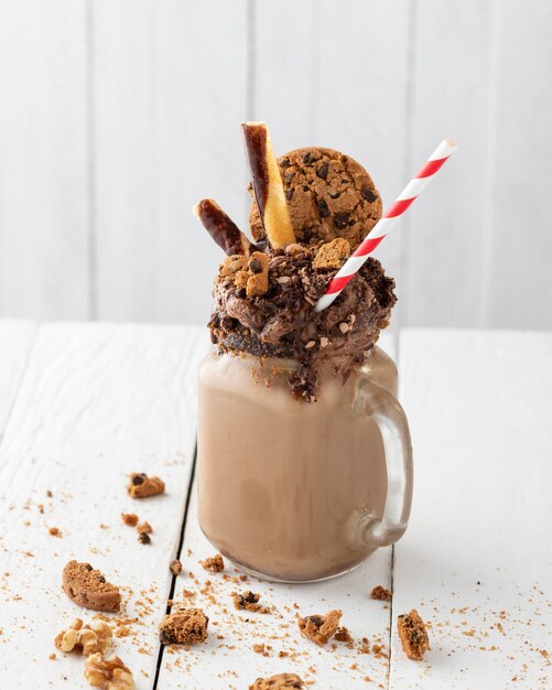 Glass of chocolate shake on table