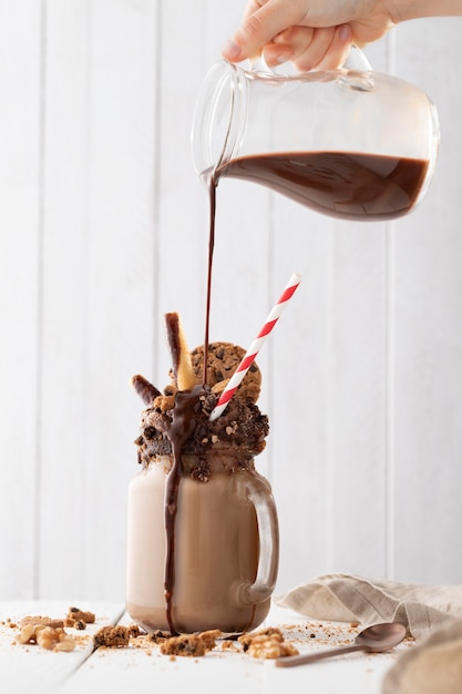 Glass of chocolate shake on table