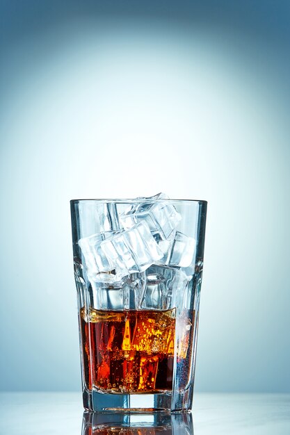 Glass of cola with ice cubes