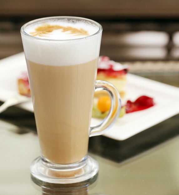Glass of cold coffee with foam