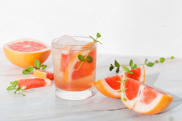 Glass of cold lemonade with grapefruit