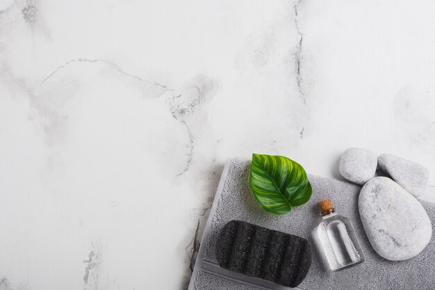 Glass container towel and rocks with copy space