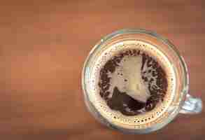 Free photo glass cup with coffee seen from above