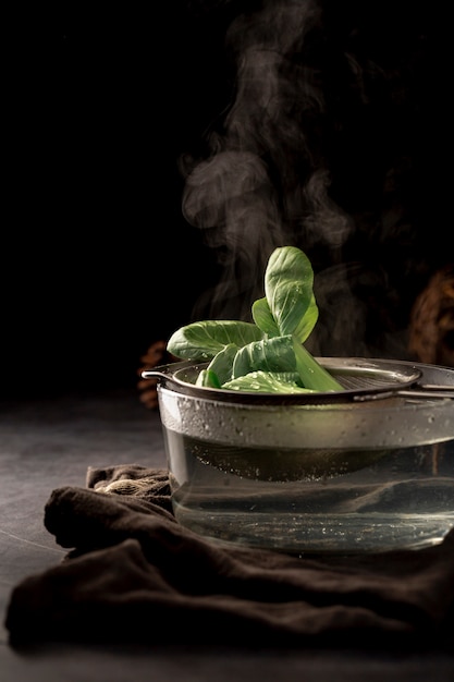 Glass cup with a tea net and tea leaves