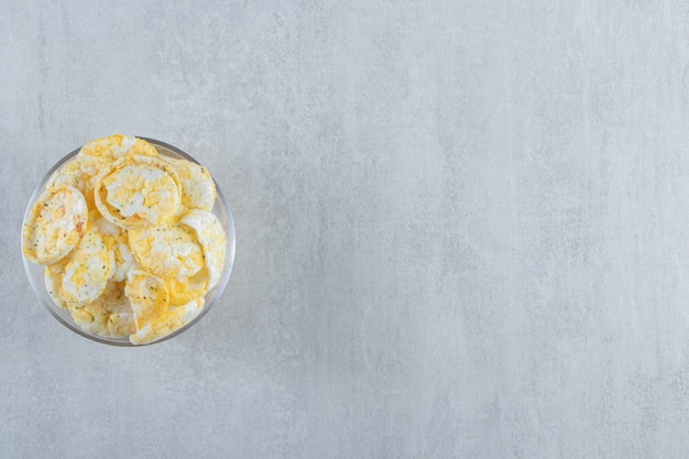 Glass of delicious crispy rice cakes on stone.