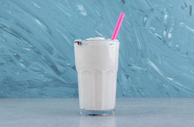 A glass of delicious milks hake on the marble background. High quality photo