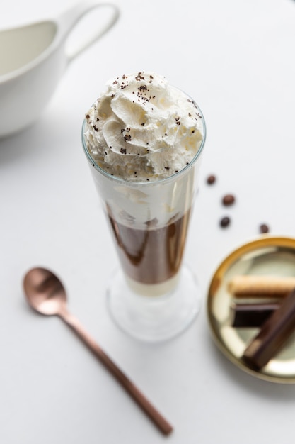 Glass of frappucino on table