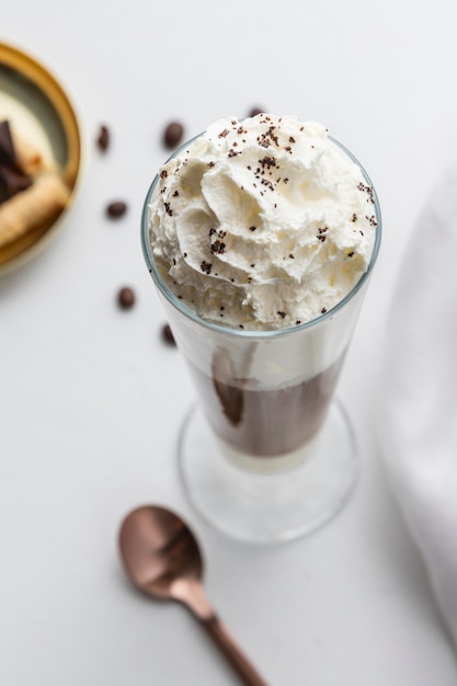 Glass of frappucino on table