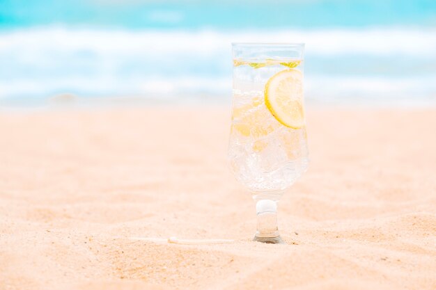 Glass of fresh drink with sliced lime