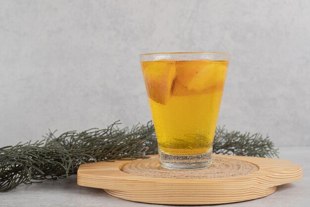 Glass of fresh lemonade with fruit slices