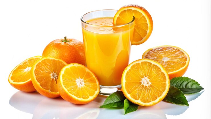 Free Photo a glass of fresh orange juice with oranges and leaves on a white background