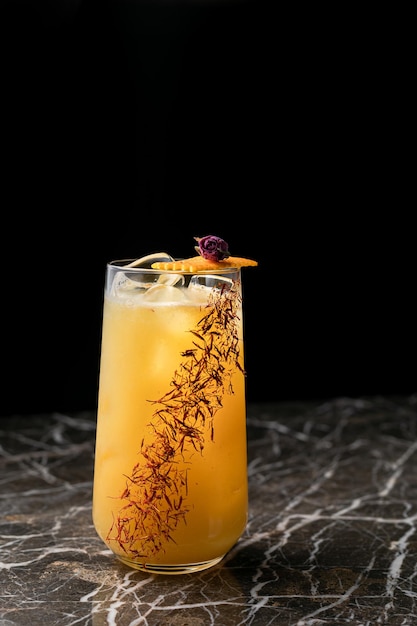 A glass of iced cocktail decorated on table