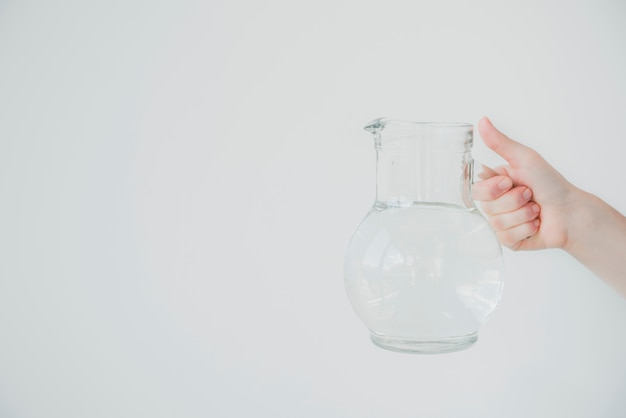 Free photo glass jar full of water being held